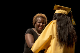 Principal Alisha Kiner shakes hands with a graduating senior of Booker T. Washington's 2017 class. 