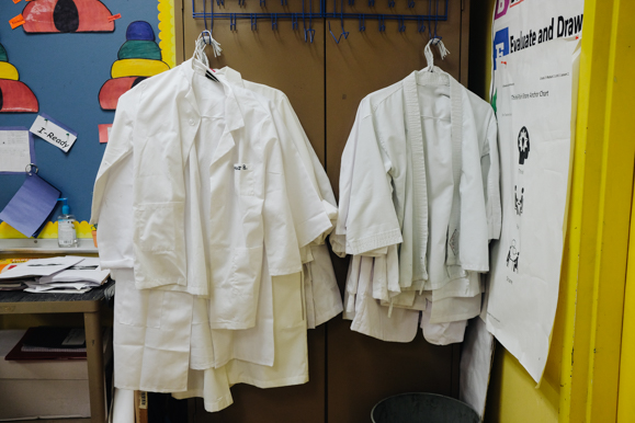 Dr. Collins gives her students lab coats when they work on science lessons in class. At the end of the year, the students can take their coats home. (Brandon Dahlberg)