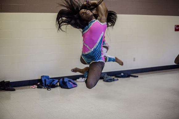  Ebony Parker, 18, leaps during a dress rehearsal at the Dave Wells Community Center in Smokey City.