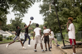 A game of basketball along Radford Road in Orange Mound.