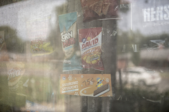 Deidra Tuggle, the Candy Lady of Orange Mound, displays her offerings on the window of her home.