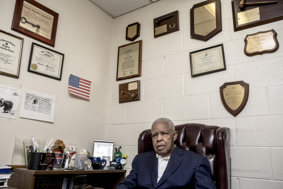 Fred Davis sits for a portrait at his insurance office on Airways Boulevard. 