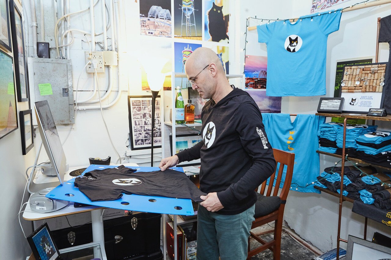 Andy Torres rents one of Arrow's six semi-private studios. Here he works on a screen print t-shirt. (Ziggy Mack)