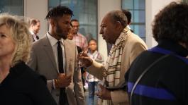 Multimedia artist Lawrence Matthews of The Collective talks with Dr. David Acey, professor of African-American rhetoric and creator of Africa in April at Black Resistance Opening Reception hosted by The Brooks programmed by The CLTV. (Ashley Bend)