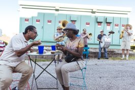 Residents of Madison Heights enjoy food from neighborhood restaurants while the Mighty Souls Brass Band plays an upbeat jazz number. (Ziggy Mack) 