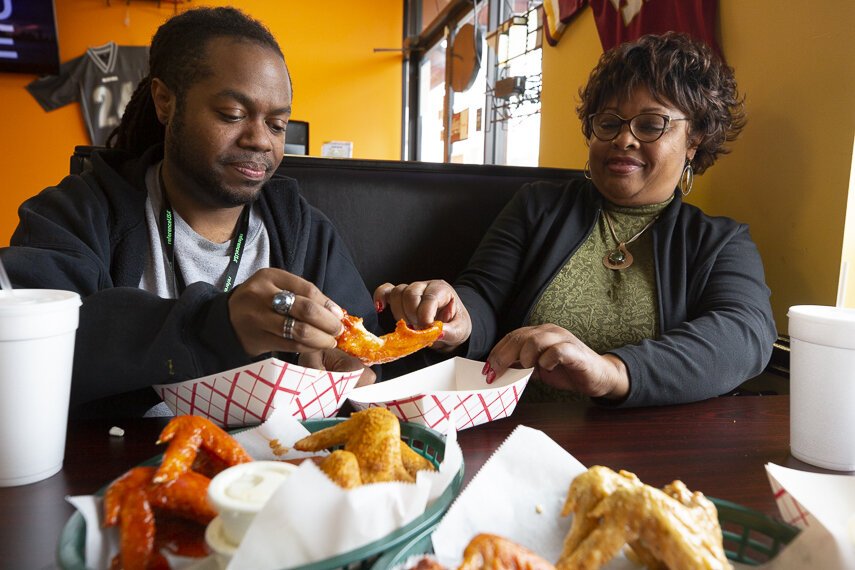 High Ground's A.J. Dugger and Hickory Hill resident Connice Nunn split a whole wing at Mike's Wings & Such. (Ziggy Mack)