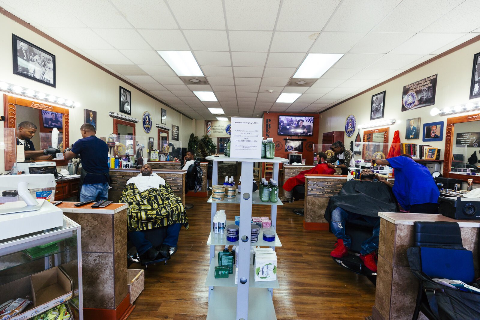 Barbers and clients at the Presidential Barber Lounge located at 1320 Madison Avenue in Madison Heights. (Ziggy Mack)