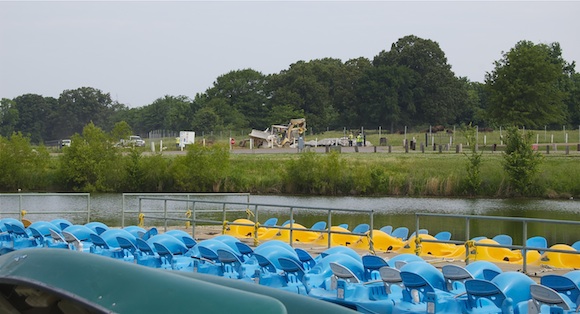 Construction and bison can be seen behind rental boats on Patriot Lake