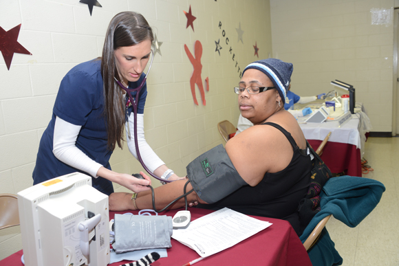 A Methodist nurse takes a patient's blood pressure at a Wellness Wednesday in the 38109 zip code