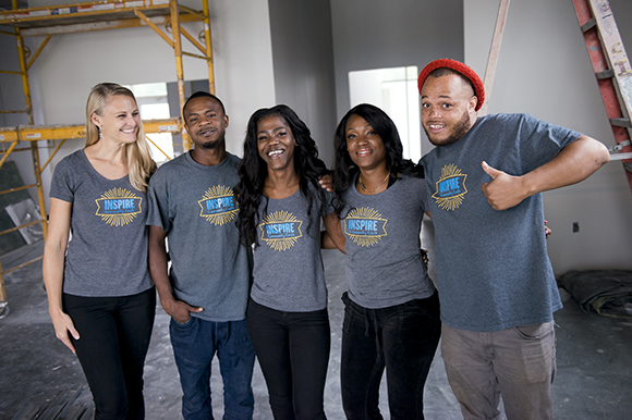 Inspire Community Cafe owner Kristin Fox-Trautman, left, poses for a photo with her team, from left, Tevin Whitley, Jacqueline Chandler, Charlena Branch, and Terrance Whitley, inside the restaurant which is currently under construction. (Brandon Dill
