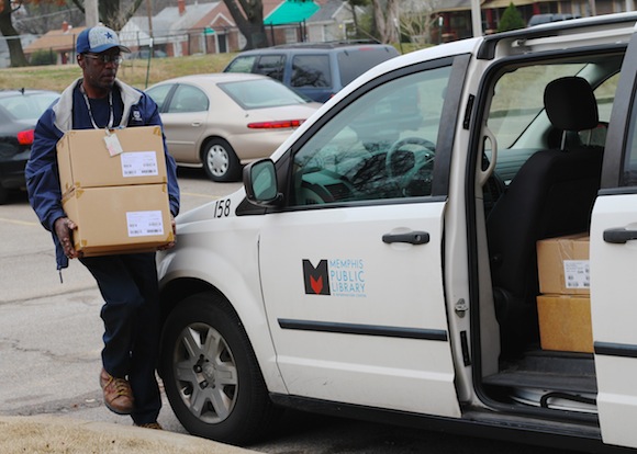 Ralph Bridgewater, Supervisor Delivery Distribution for Memphis Public Libraries loads a van full of free books.