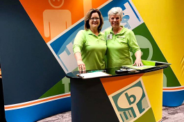 Pam Cooper, left, and Ginny Parker are promoting Boosterville at the Indiana PTA convention in early May. The Coopers have a strategic relationship with the National PTA. and have loaded in 32,000 PTAs across the country in the Boosterville app.