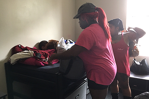 Packing for the move, Raven Driver reflects on how far she’s come with the support from loved ones.