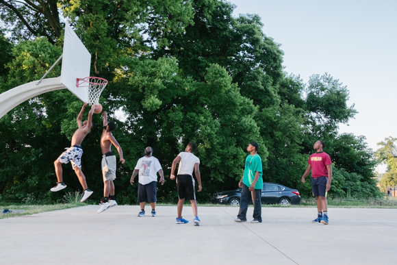 Young men play basketball in Booker T. Washington park. (Brandon Dahlberg)