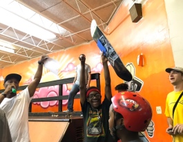 Courtlan Black is all smiles as David Yancey announces him the winner of the boys' aged 13 to 15 division at a skate competition held at the Greenlaw Community Center (Cole Bradley)