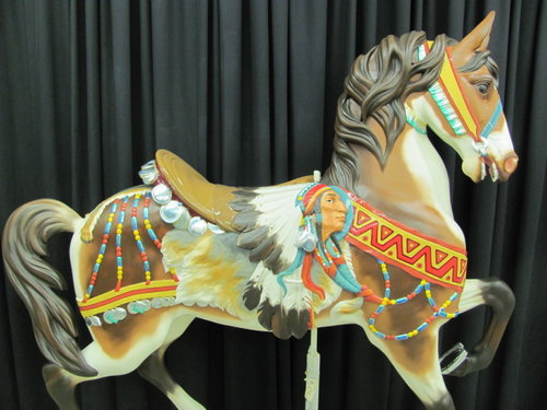 A restored horse as part of the grand carousel.