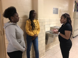 Flying Falcon staff writer Leah Boone-Stewart (R) interviews Lanaya Hamilton (L) and Bionica Barnes for an article. (Flying Falcon)