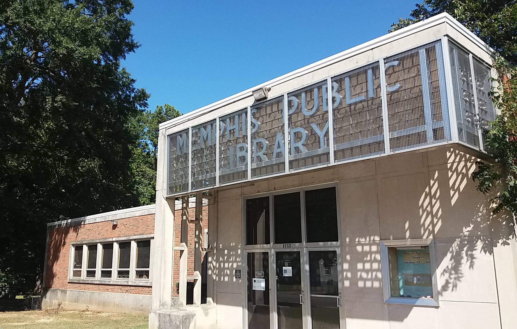 Memphis Library Foundation's first update to Randolph Library was to remove the sign's metal frame and add lighting and a blue background and lighting. (MLF)