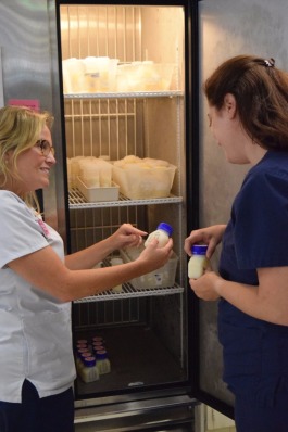 Ashley Smith (L) and Elaina Hogan with the milk depot at Regional One Health.