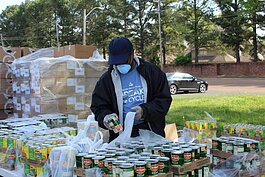 A Neighborhood Christian Center volunteer preps meals for families in response to Covid-19. (Submitted)