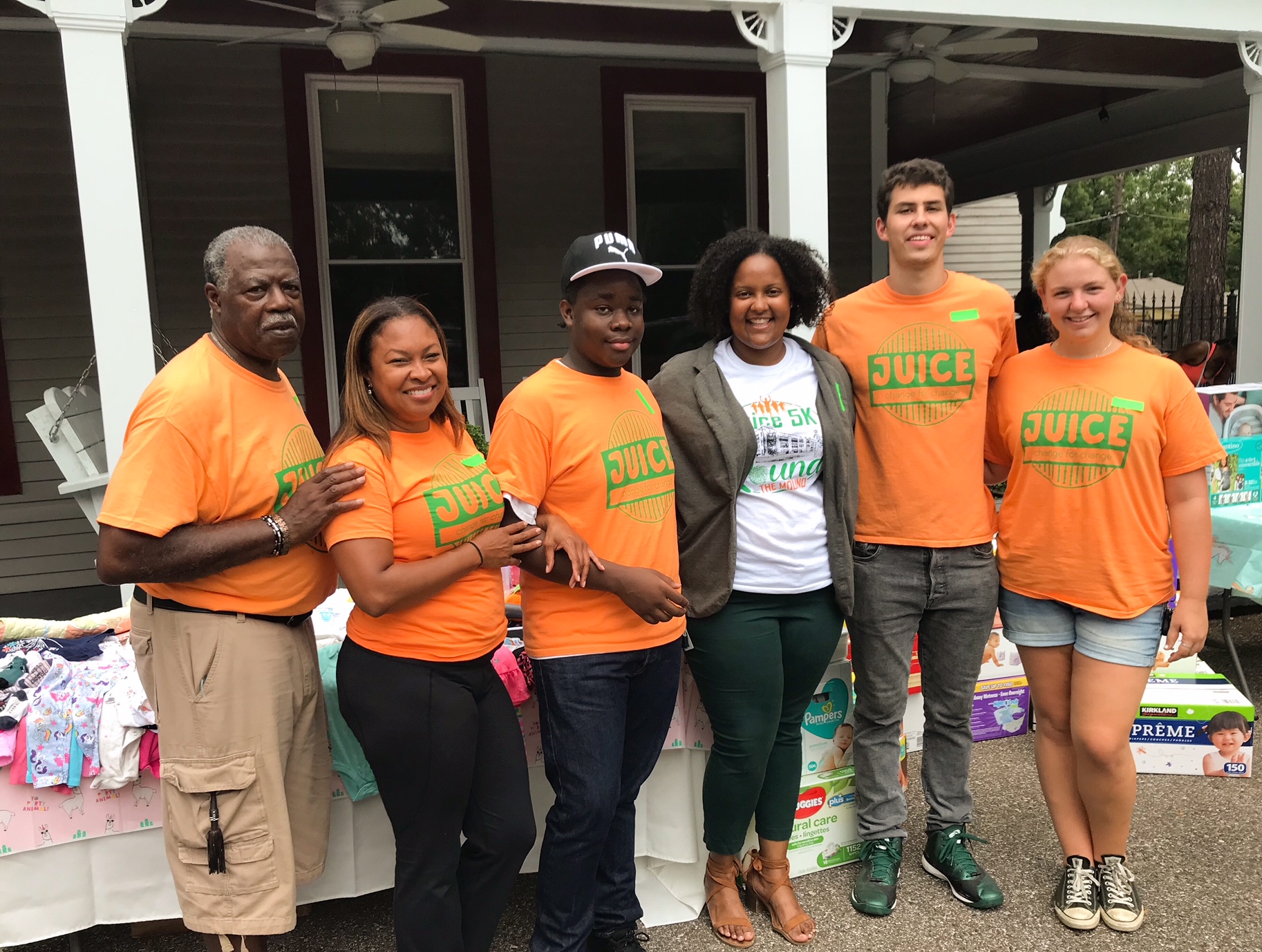 The board of JUICE Orange Mound including Kenya Moore (2nd from left) and Britney Thornton (4th from left) poses for a picture outside of The House. (Cole Bradley)