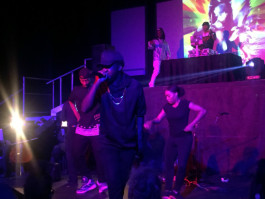 Local hip hop artist Marco Pavé performs at Midtown Opera Festival, flanked by backup dancers, DJs and instrumentalists