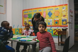 Refugee Empowerment Program volunteers work with children in the Pre-K class. (Averell Mondie)