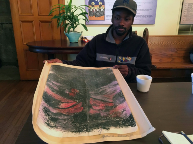 Marcus Mitchell, 35, with his drawing The Dark World at one of the weekly art classes at St. Mary’s Episcopal Church.