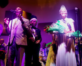 Shelby County Mayor Lee Harris (L) presents the Senior Prom's 2019 Prom Queen Everlena Yarborough. Prom King Clarence Christian watches with pride. (Baris Gursakal)