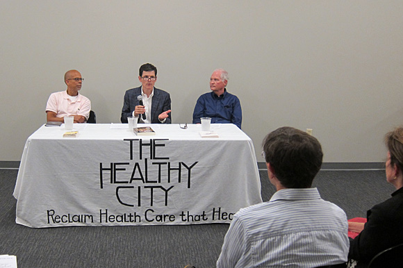 Dr. Clarence Davis (left), Dr. Jim Bailey and Dr. G. Scott Morris spoke about health care reform at the first Healthy City Town Hall meeting held at Novel bookstore on Sep. 16.