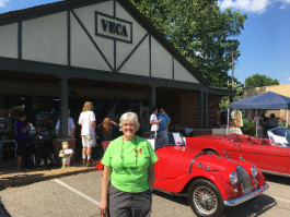 VECA board member Marci Hendrix greets visitors as they arrive at the inaugural VECA Street Faire. 