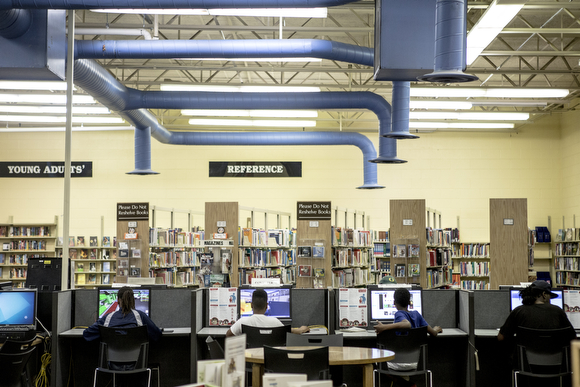 Patrons use the computers at the Cornelia Crenshaw Library. 