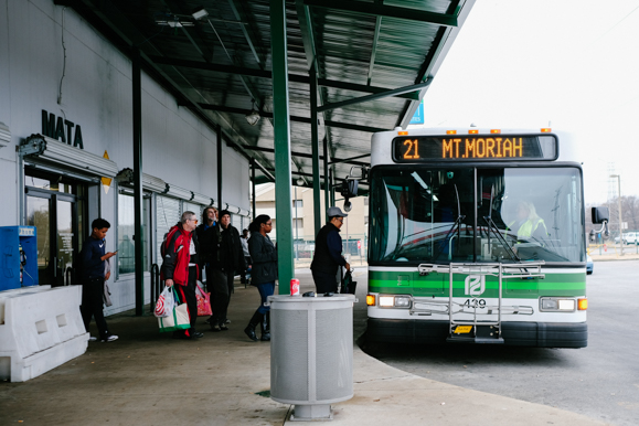 A group of passengers prepares to board a MATA bus at the American Way Transit Center on January 9, 2018. (Brandon Dahlberg)