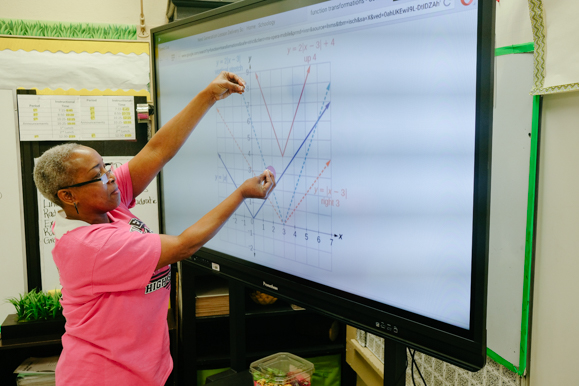 Sondra Bush demonstrates a trigonometry problem at Whitehaven High School.