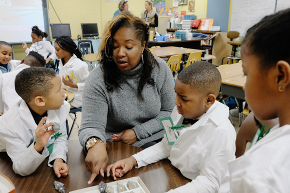 Dr. Collins works with Johnathan Bush, 7, Ethan Jordan, 8, and Daja Foster, 8. (Brandon Dahlberg)