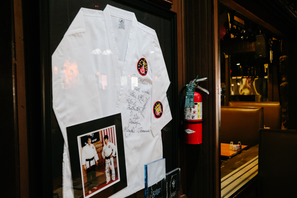 A signed gi and accompanying photograph of Elvis wearing it on display inside Marlowe's Ribs & Restaurant. (Brandon Dahlberg)