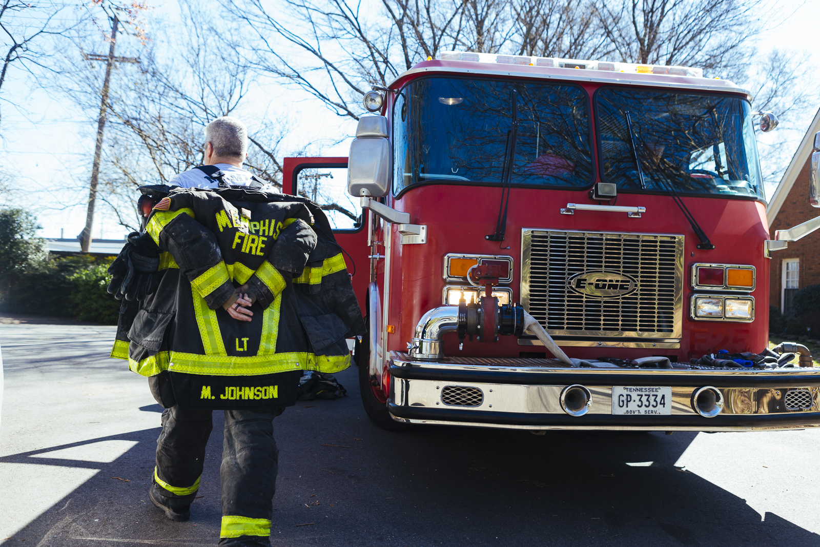 Lieutenant Mark Johnson with the Memphis Fire Department's Fire Station 18 walks beside the station's pumper truck. (Ziggy Mack)