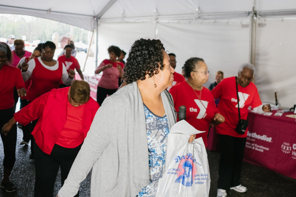 Members of the YMCA perform a dance as community members join in at Methodist South's Whitehaven Healthy Community Day on April 8, 2018. (Brandon Dahlberg)