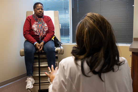 Betty Jones, attending an appointment at Methodist South, speaks with nurse practioner Nykkia Sellers. (Brandon Dahlberg)