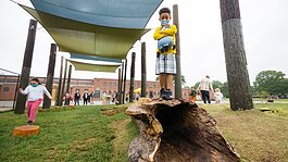 Andres Arevalo (center) and other children explore the new Treadwell Park Nature Playground in the Nutbush area of The Heights. (Ziggy Mack)