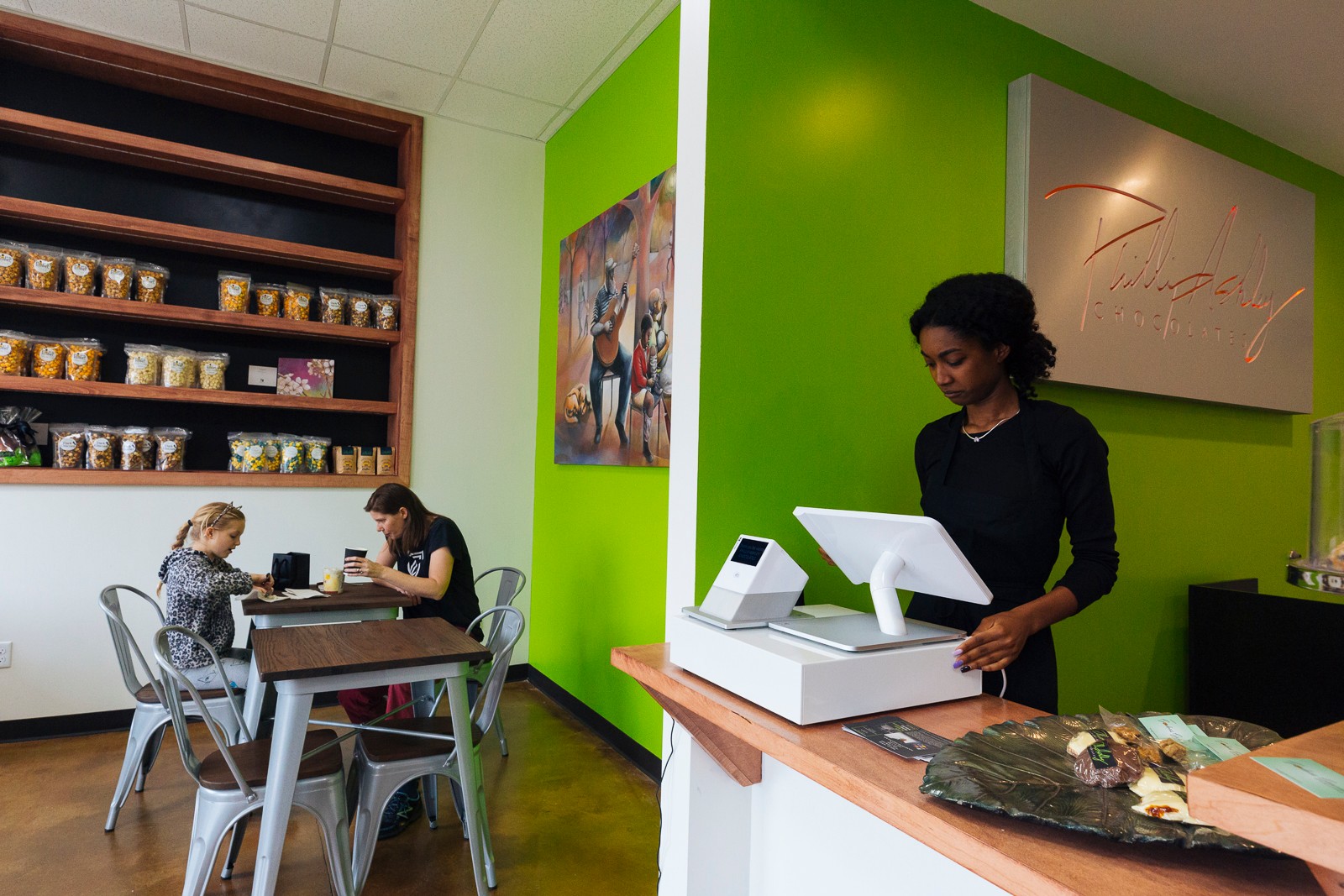 Joann Selvidge and her daughter, Frannie, enjoy their designer confections at Philip Ashley Chocolates cafe, located at 1200 Madison Avenue in Madison Heights District. (Ziggy Mack)