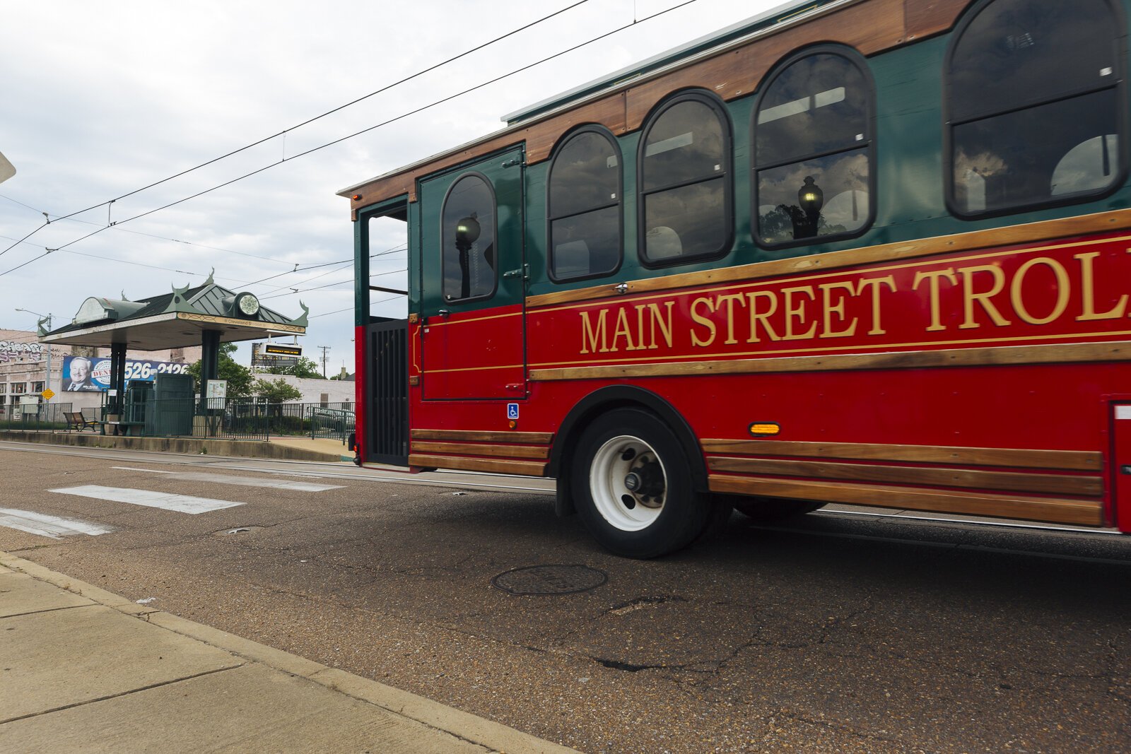 A modified MATA bus, designed to look like MATA's 100-year-old vintage electric trolley fleet, heads towards a trolley stop on Madison Avenue near Claybrook in Madison Heights. (Ziggy Mack)