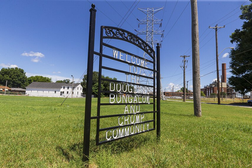 A sign marking two of North Memphis' distinct neighborhoods sits in front of a church and Penn A Kem, LLC. chemical plant. (Ziggy Mack)