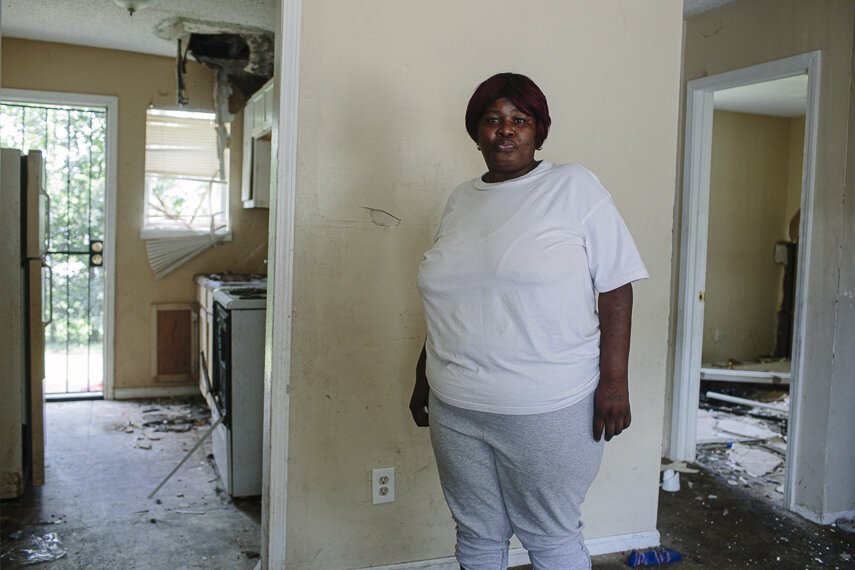 Portrait of Kenzie Cleaves inside a vacant unit in her North Memphis apartment complex. Cleaves said it's been unsecured for over a year. Unsafe housing conditions can contribute to chronic conditions like asthma and heart disease. (Ziggy Mack)