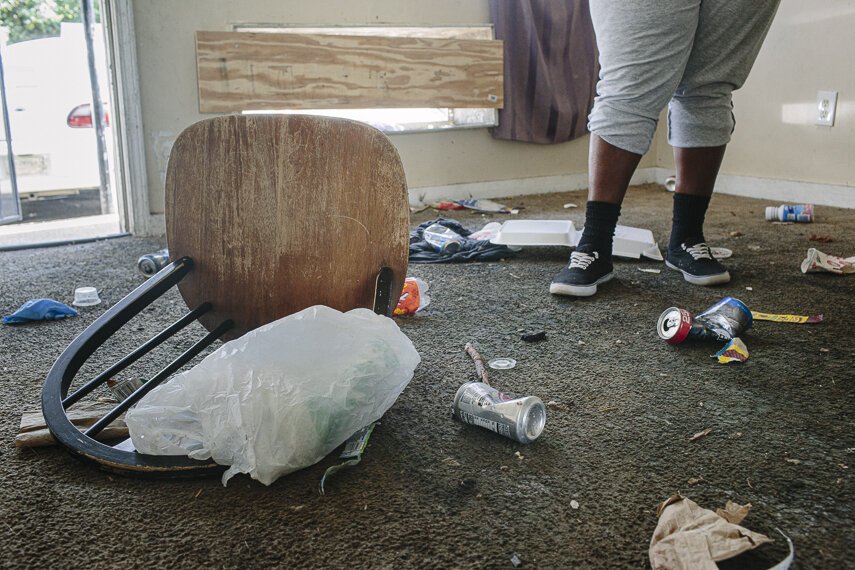 Kenzie Cleaves stands inside a vacant unit in her North Memphis apartment complex that she said has been unsecured for over a year. Unsafe housing conditions can increase COVID-19-related deaths. (Ziggy Mack)