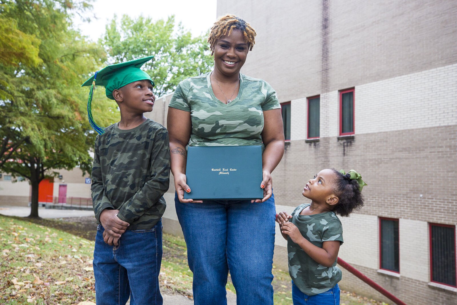 Marquetta Wilson poses with her children and her high school diploma. Wilson earned her diploma from the Goodwill Excel Center in June 2020 at 30 years old. Excel's adult learning program is free to participants. (Ziggy Mack)