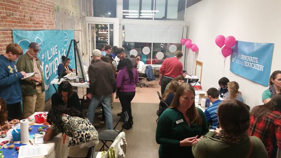 Dr. Sarah Petschonek (foreground) works with volunteers at a Downtown volunteer pop-up event.