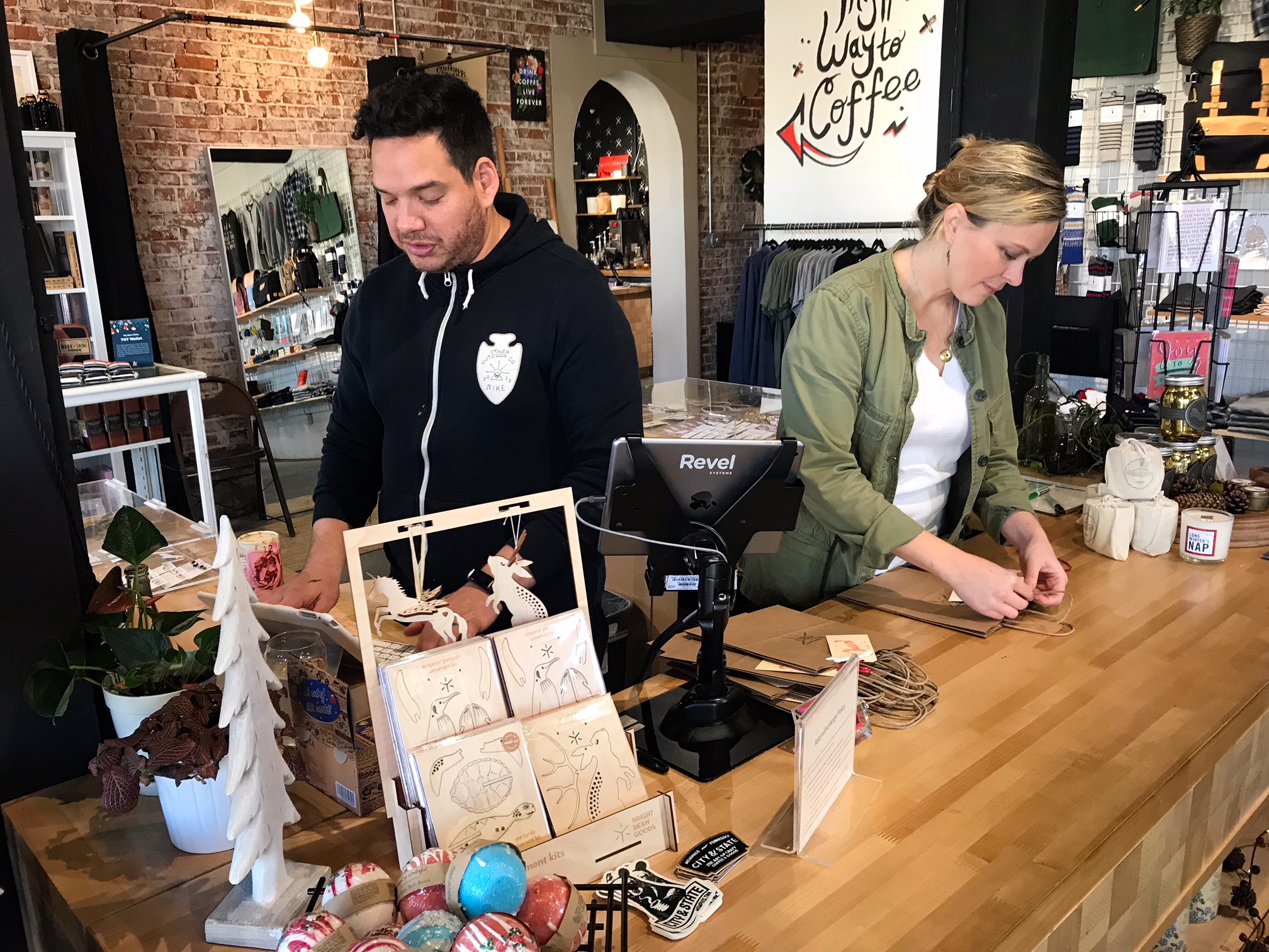 Luis and Lisa Toro work in the retail area of their flagship location, City & State. (Cole Bradley)