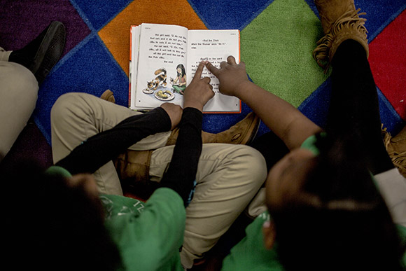 Students in Tamika Hunter's second grade class work  on a class assignment in Smokey City.