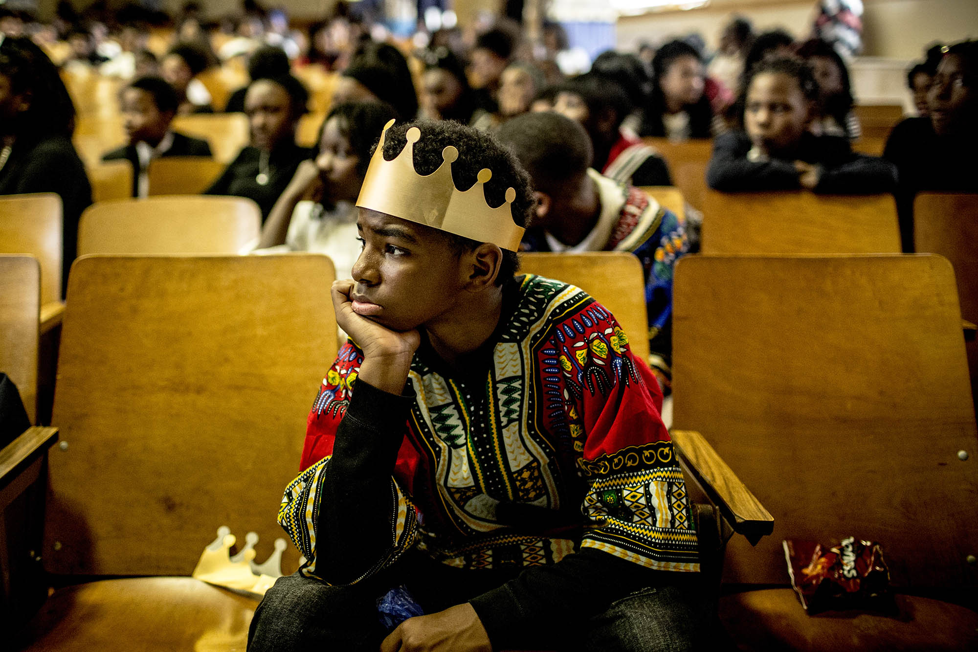 Students at Humes Preparatory Academy wait for parents and community members to take their seats.